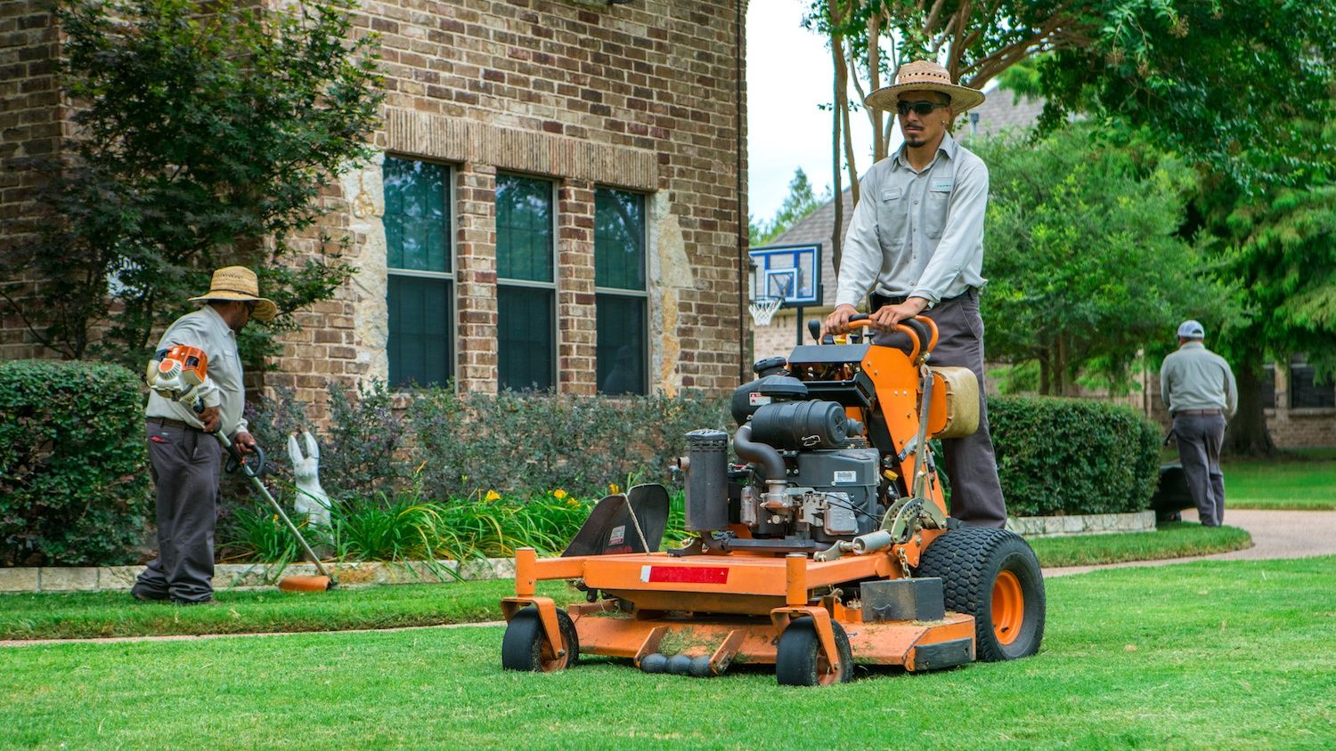 grassperson-crew-lawn-maintenance-mowing